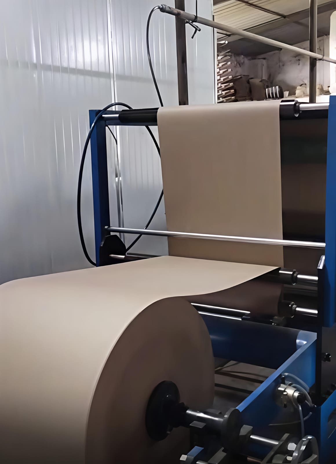 Paper reel feeding into winding machine